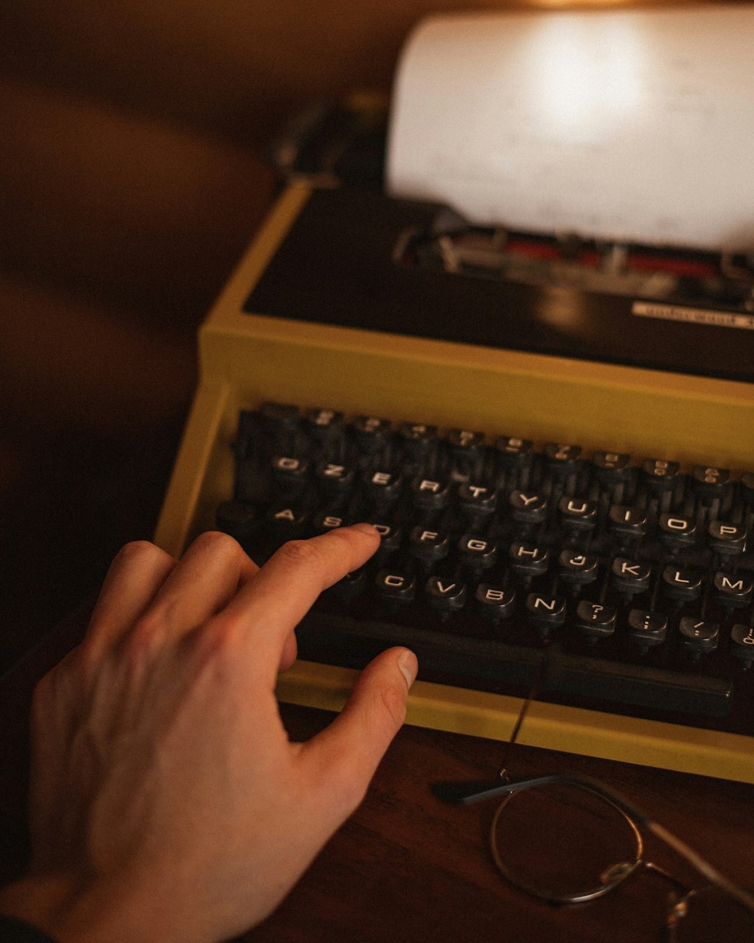 writer typing on typewriter